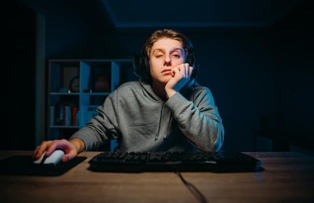 tired-young-man-headset-playing-video-games-home-computer-room-with-blue-light_245974-7994