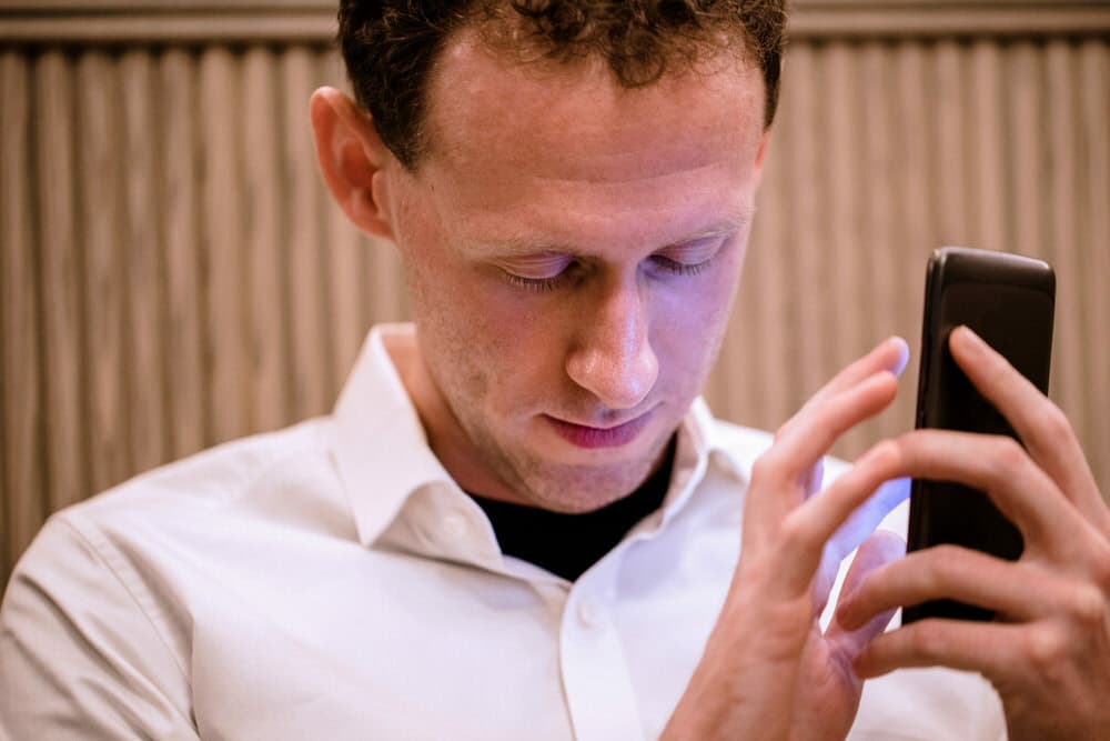 accessibility-blind-man-using-a-mobile-phone