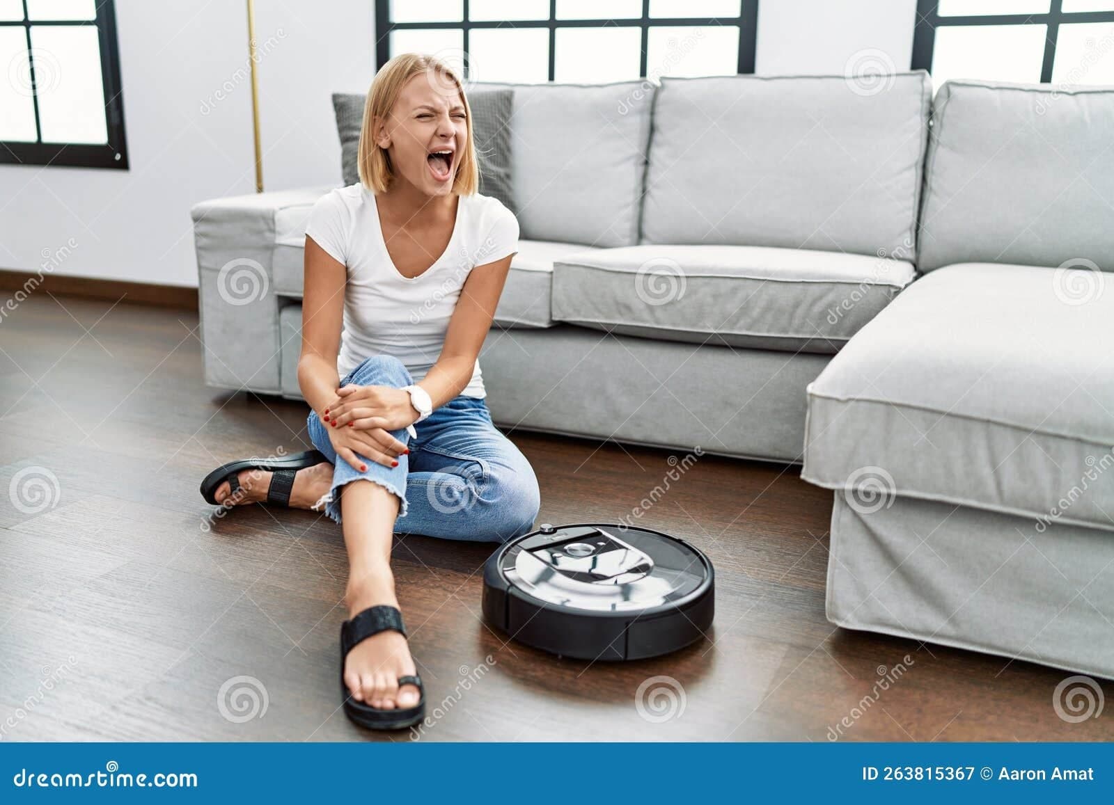 young-caucasian-woman-sitting-home-vacuum-robot-angry-mad-screaming-frustrated-furious-shouting-anger-young-263815367