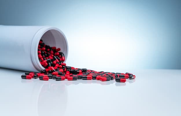red-black-antibiotic-capsule-pills-spread-out-white-plastic-drug-bottle_33867-1437