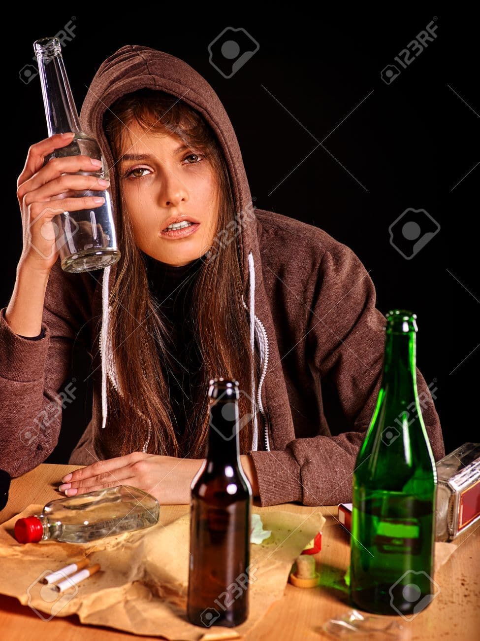 52173703-drunk-girl-holding-group-bottle-of-alcohol-soccial-issue-female-alcoholism