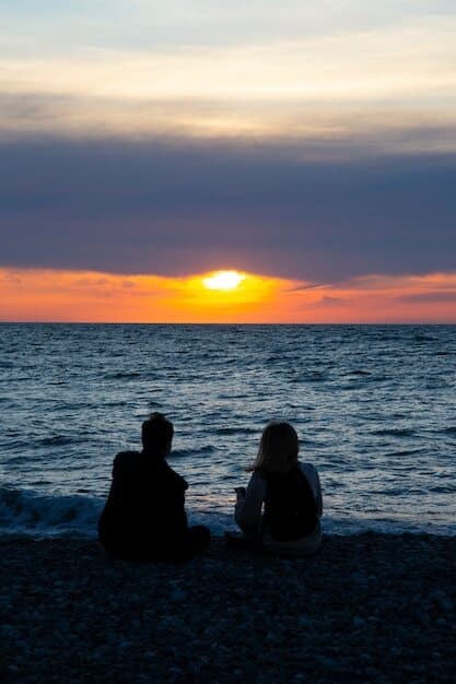 couple-love-watching-sunset-together-beach_319110-80